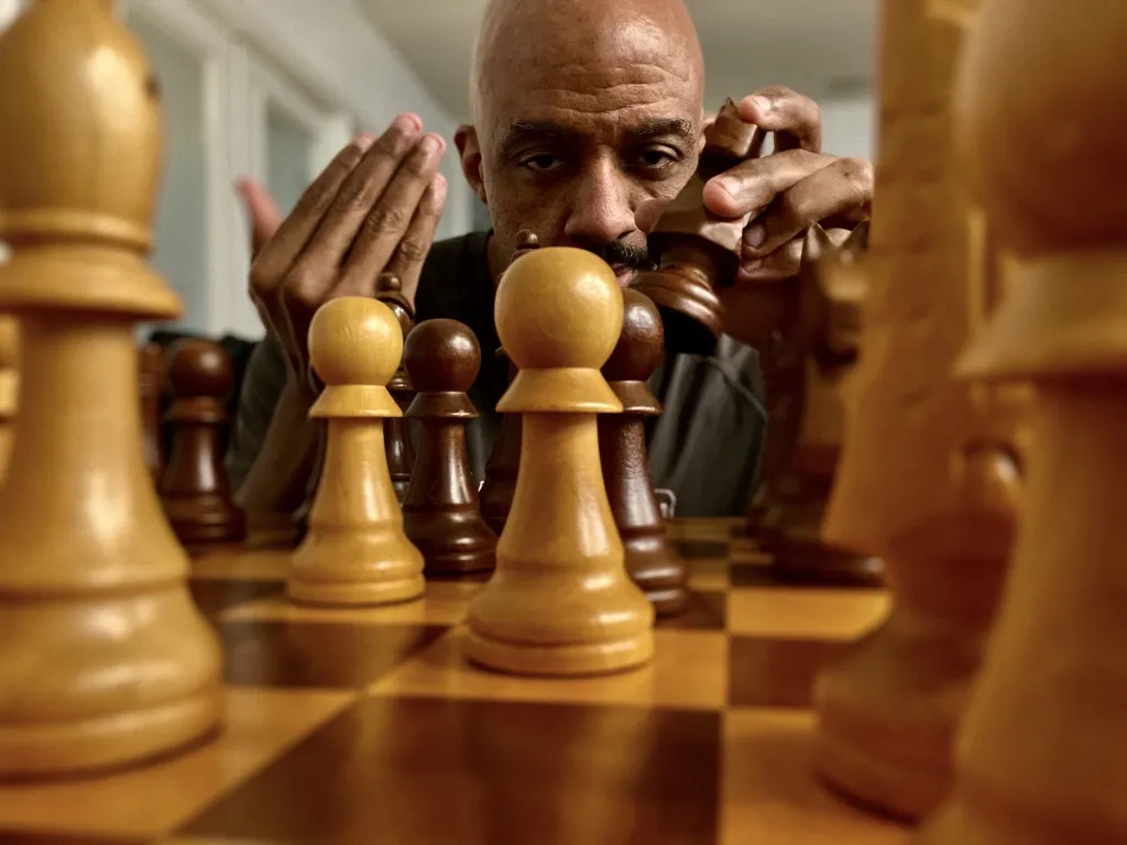 Behind the wooden pieces